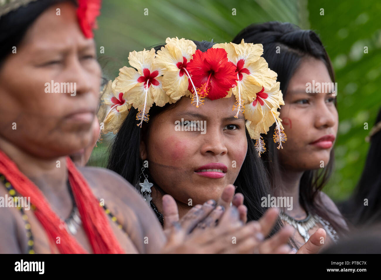 Central America, Panama, Gatun Lake. Embera Indian village. Typical village woman with tattoos and flowers in their hair. Stock Photo
