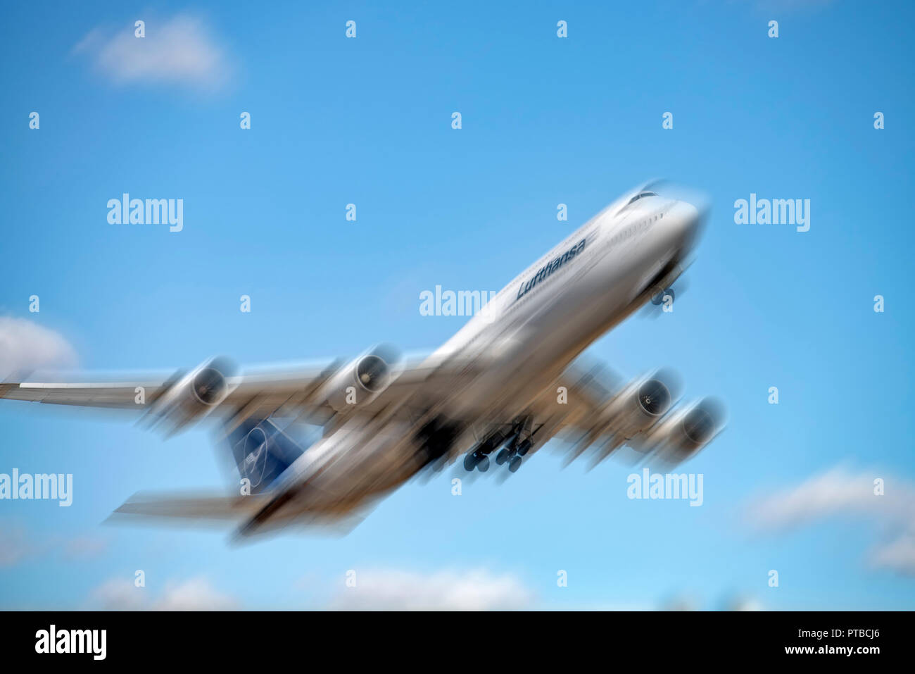 Boeing 747 of Lufthansa (D-ABYA) with new logo and motion blur [M] after takeoff from Frankfurt airport Stock Photo