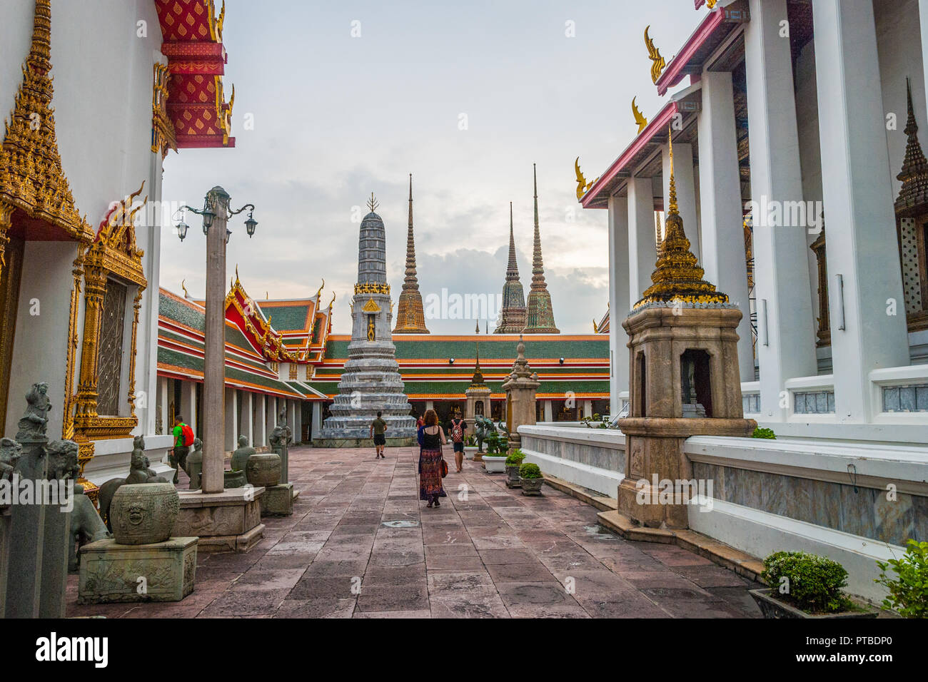 Bangkok, Thailand - Sep 10, 2015: People passing the pagodas at Wat Phra temple in Bangkok Stock Photo