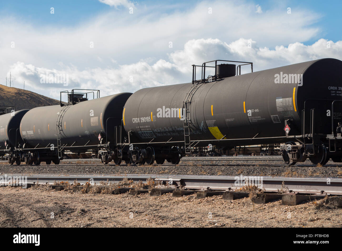 Railroad tank cars carrying hazardous materials on a siding in a train