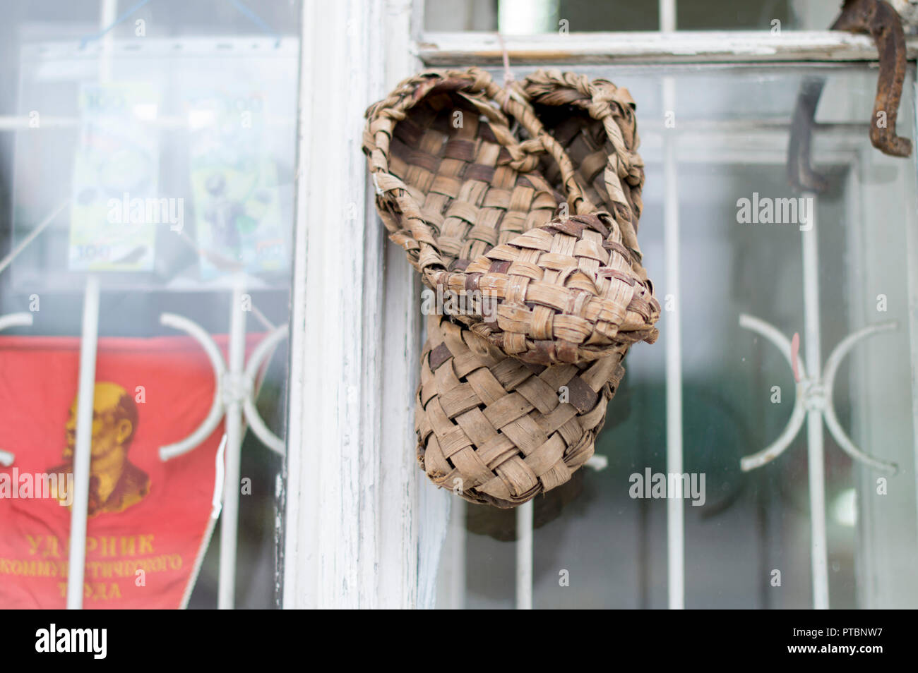 Lykovye, natural sandals weigh for sale on the window frame. Vladimir. Russia. Stock Photo