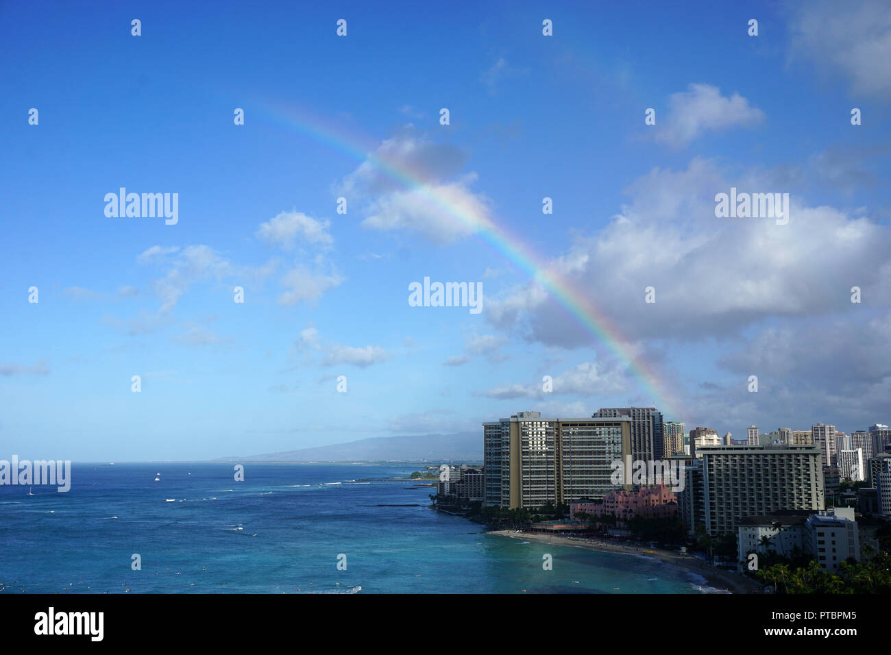 Rainbow over Waikiki Beach Stock Photo