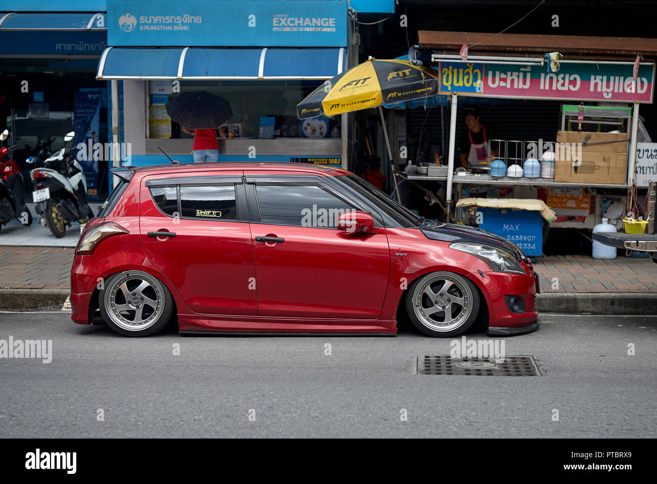 Suzuki VVT car extremely lowered to sit just above street level