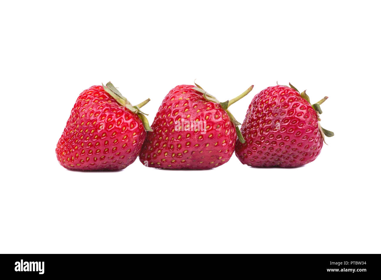 Three fresh ripe strawberry on a white background Stock Photo - Alamy