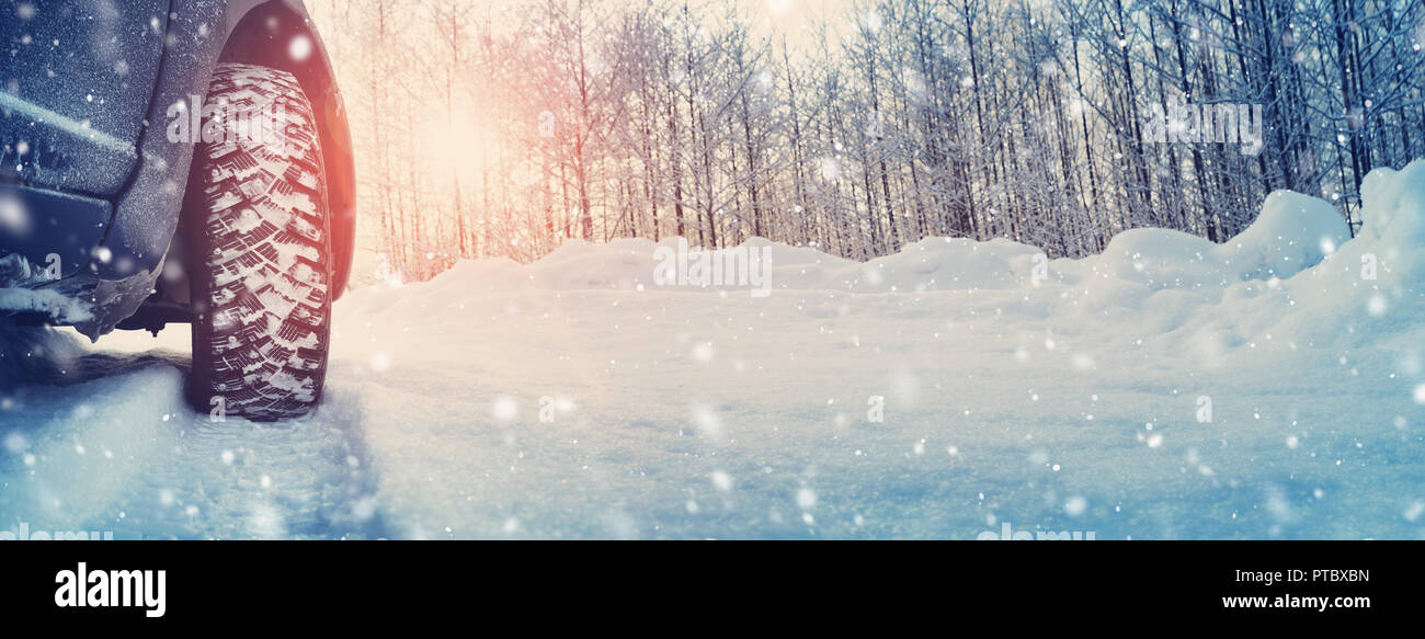 Car tires on winter road covered with snow Stock Photo - Alamy