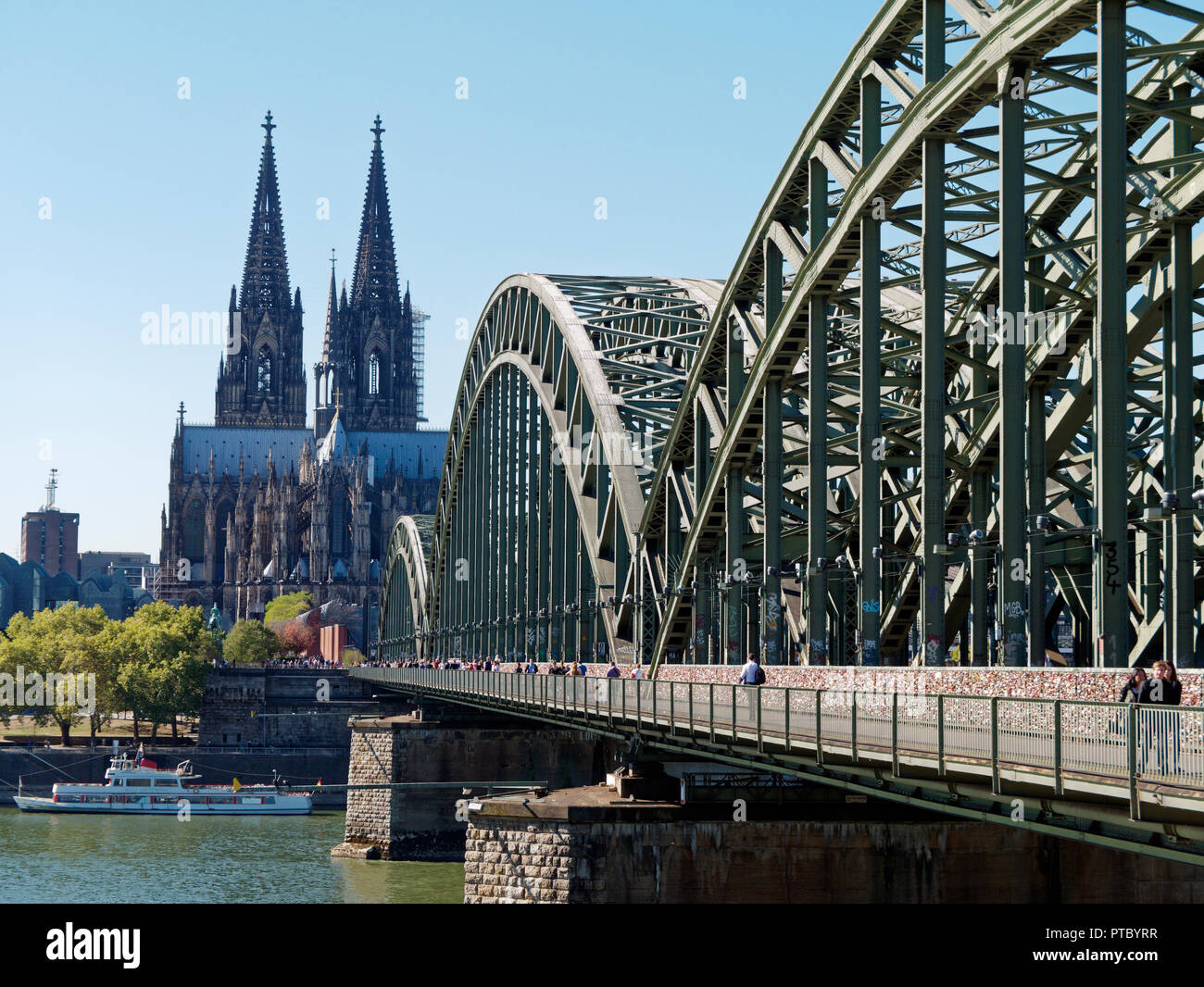 The famous Hohenzollern Bridge over the River Rhine in the centre of Cologne. One of the busiest railway bridges in Germany Stock Photo