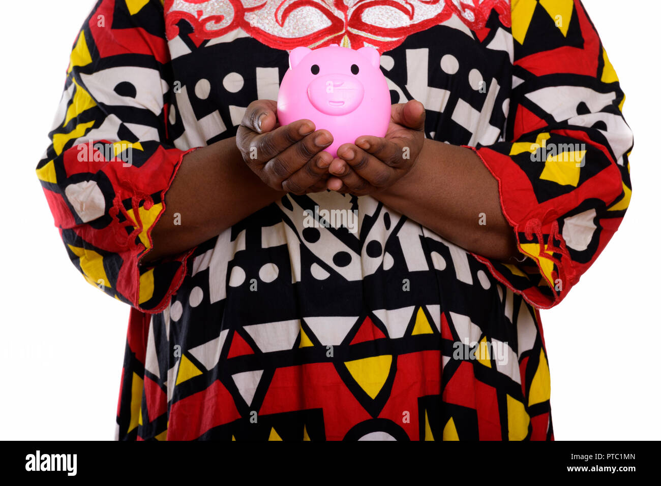 Studio shot of fat black African woman holding piggy bank Stock Photo ...
