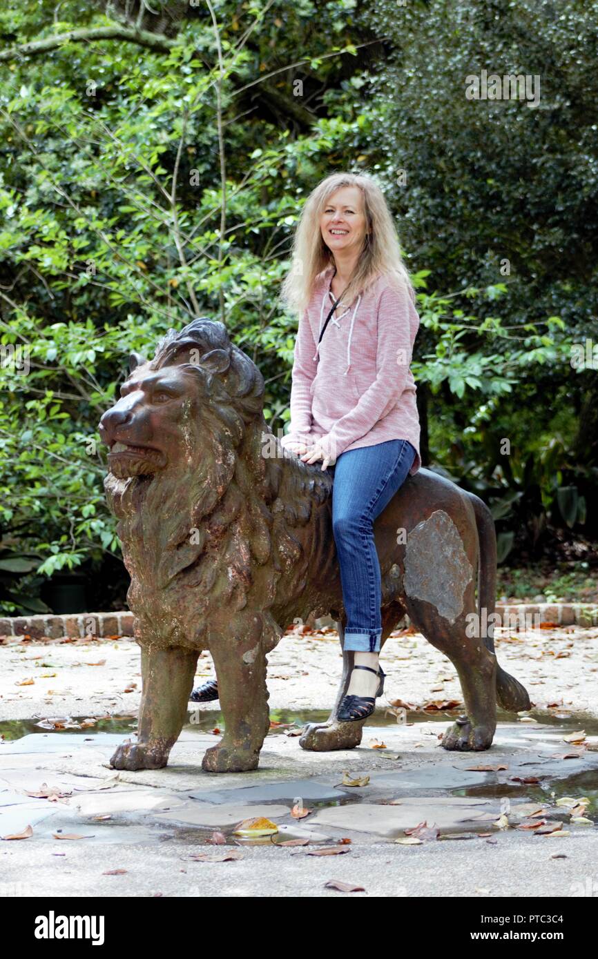 A stately lion stands guard (and gives rides) in Bellingrath Gardens Alabama Stock Photo
