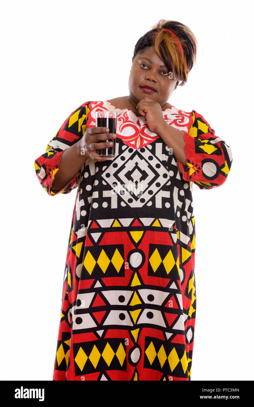 Studio shot of fat black African woman standing while thinking a Stock ...