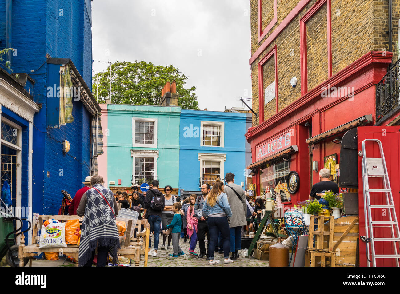 People perusing antique shops/ stalls in Denbigh Close just off Portobello Road, Portobello Market, Notting Hill, London, England, UK 2017 Stock Photo