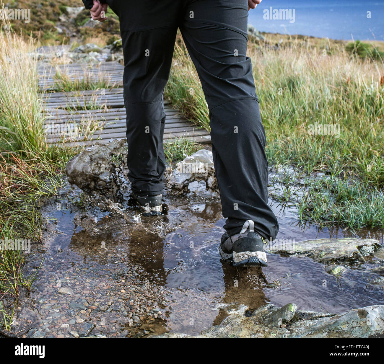 Shoes in puddle hi-res stock photography and images - Alamy