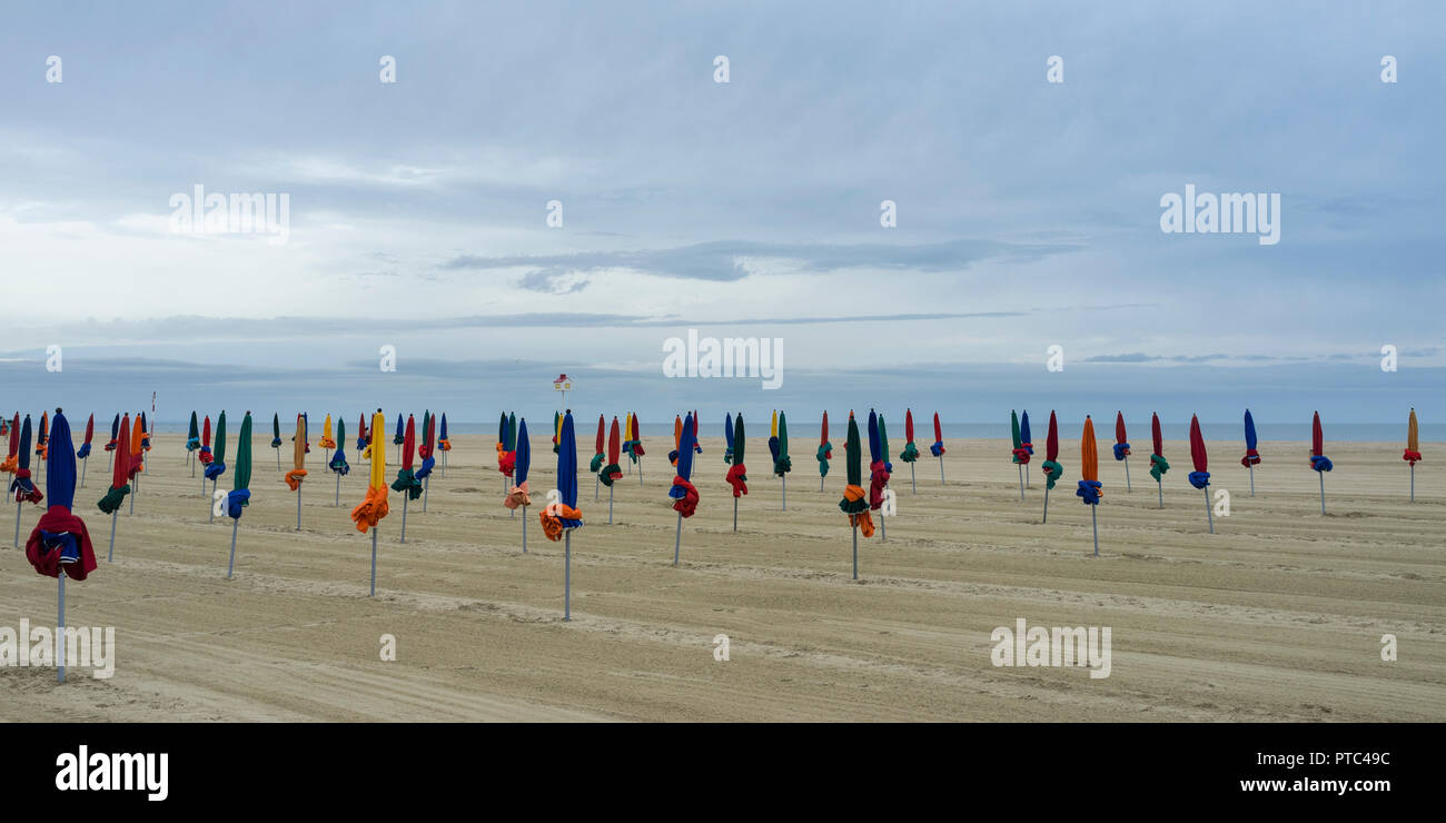 Deauville Beach On A Cloudy Morning Normandy France Umbrellas Are deauville-beach-on-a-cloudy-morning-normandy-france-umbrellas-are