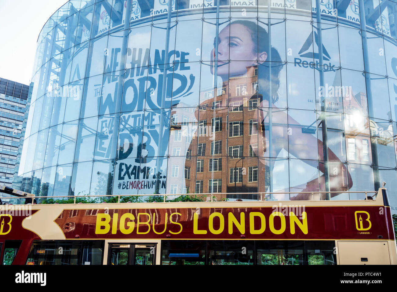 London England,UK,United Kingdom Great Britain,Lambeth South Bank,BFI IMAX,cinema,Movie theater theatre,building,exterior,glass,reflection,big bus,hop Stock Photo