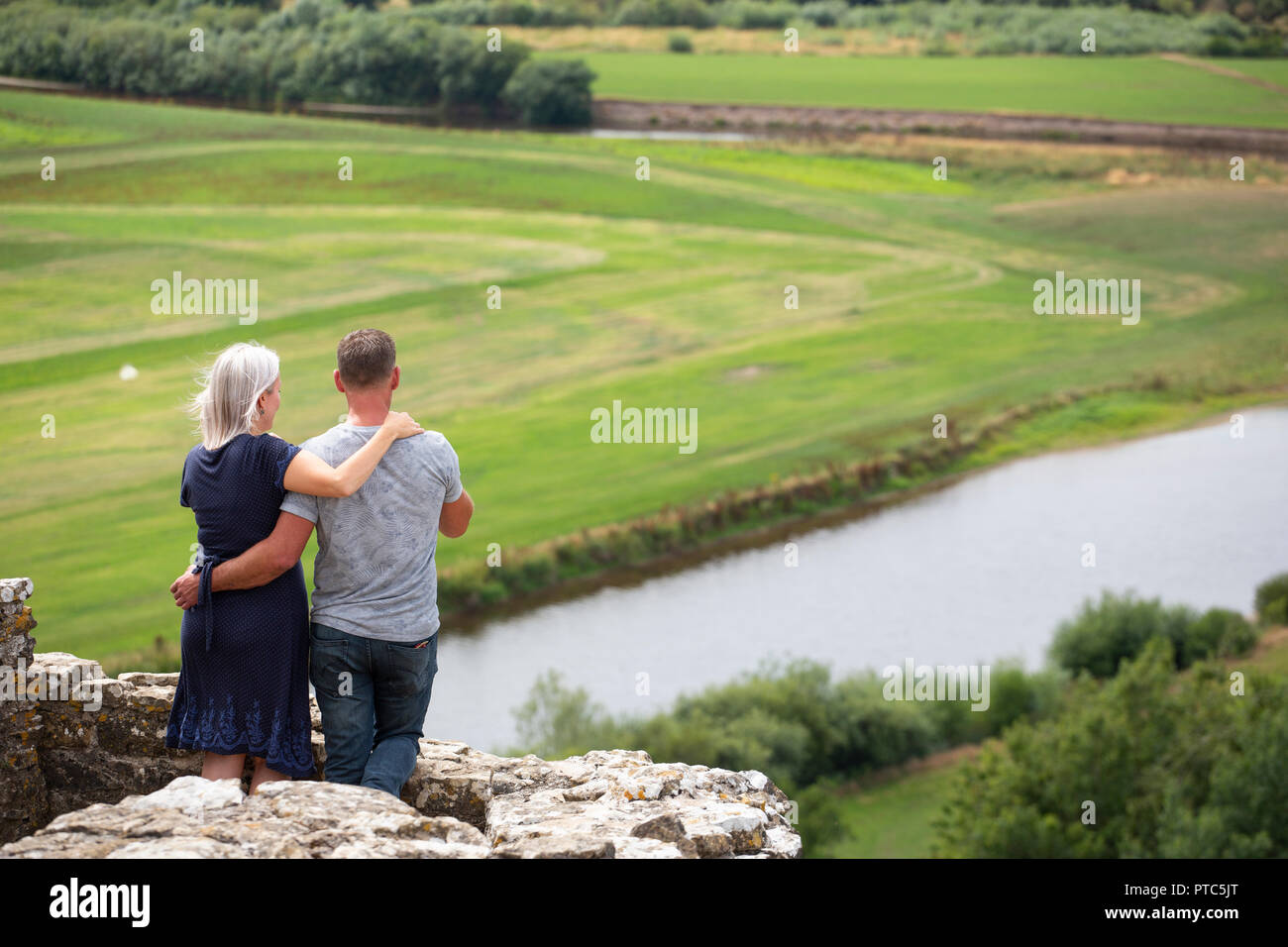 A loving couple look out across the Towy valley in Carmarthenshire Stock Photo