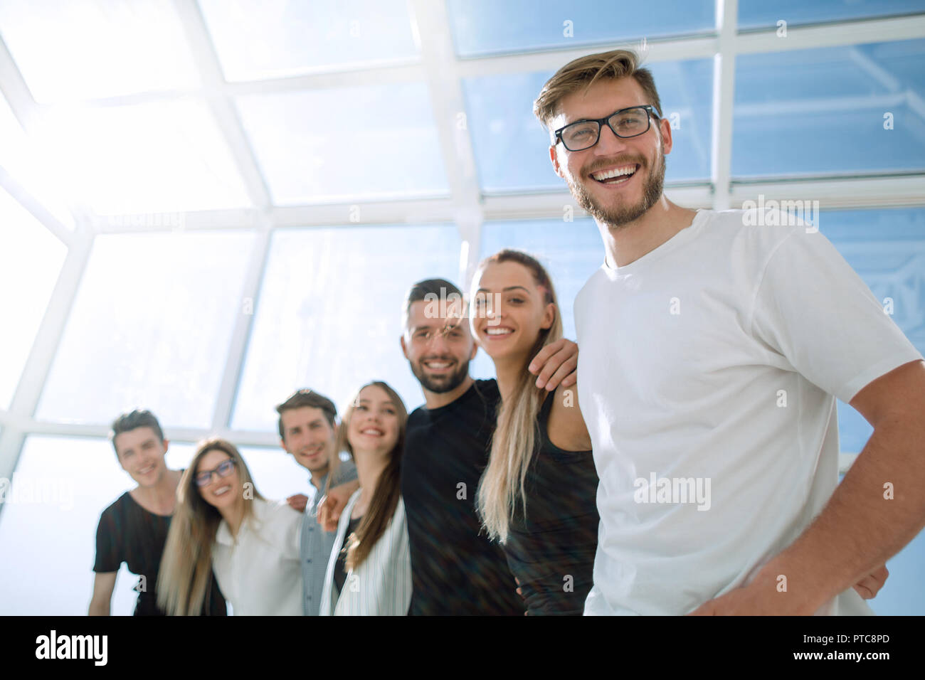 creative business team standing in a bright office Stock Photo - Alamy