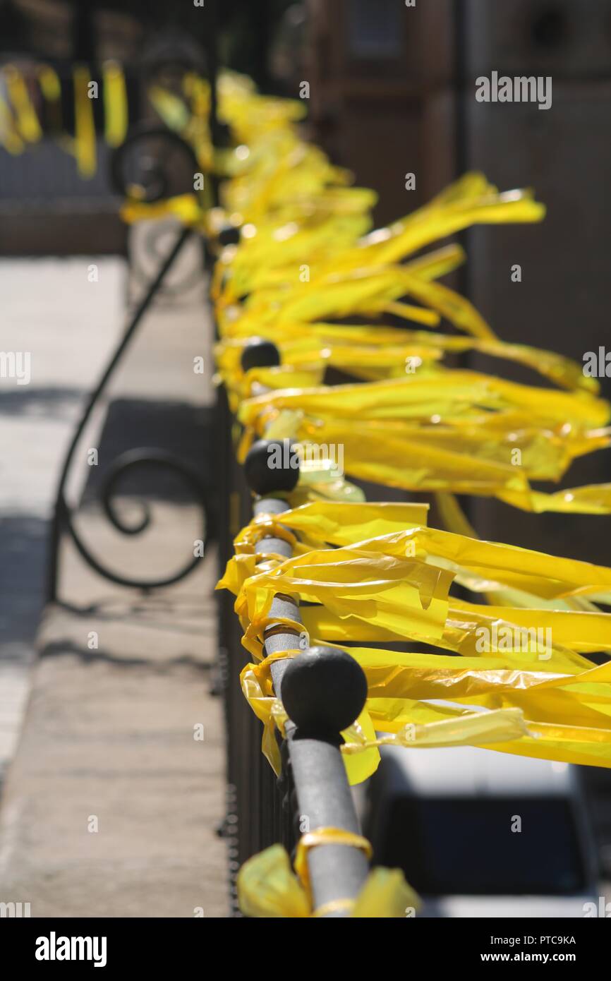 Hundreds of yellow Plastic ribbons tied to a railing in Catalonia Spain symbolising the independence struggle Stock Photo
