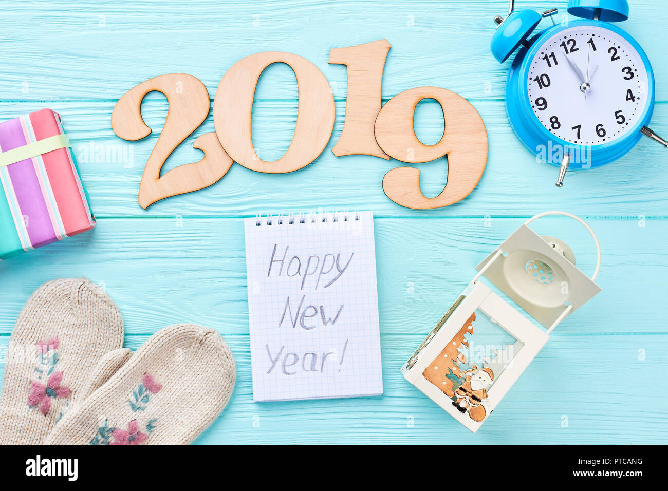 Happy New Year 2019 wooden background. Cut out wooden text 2019, alarm ...