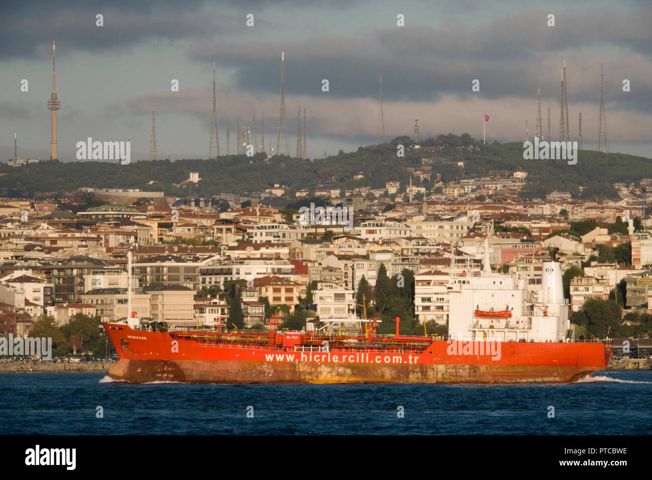 Cargo ship travels through the Bosphorus in Istanbul, Turkey Stock Photo