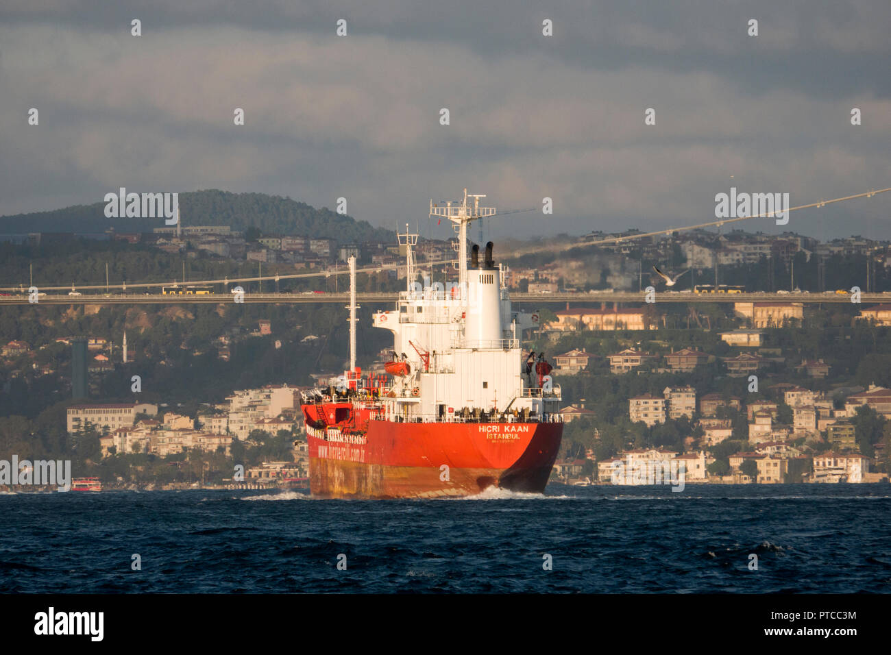 Cargo ship travels through the Bosphorus in Istanbul, Turkey Stock Photo