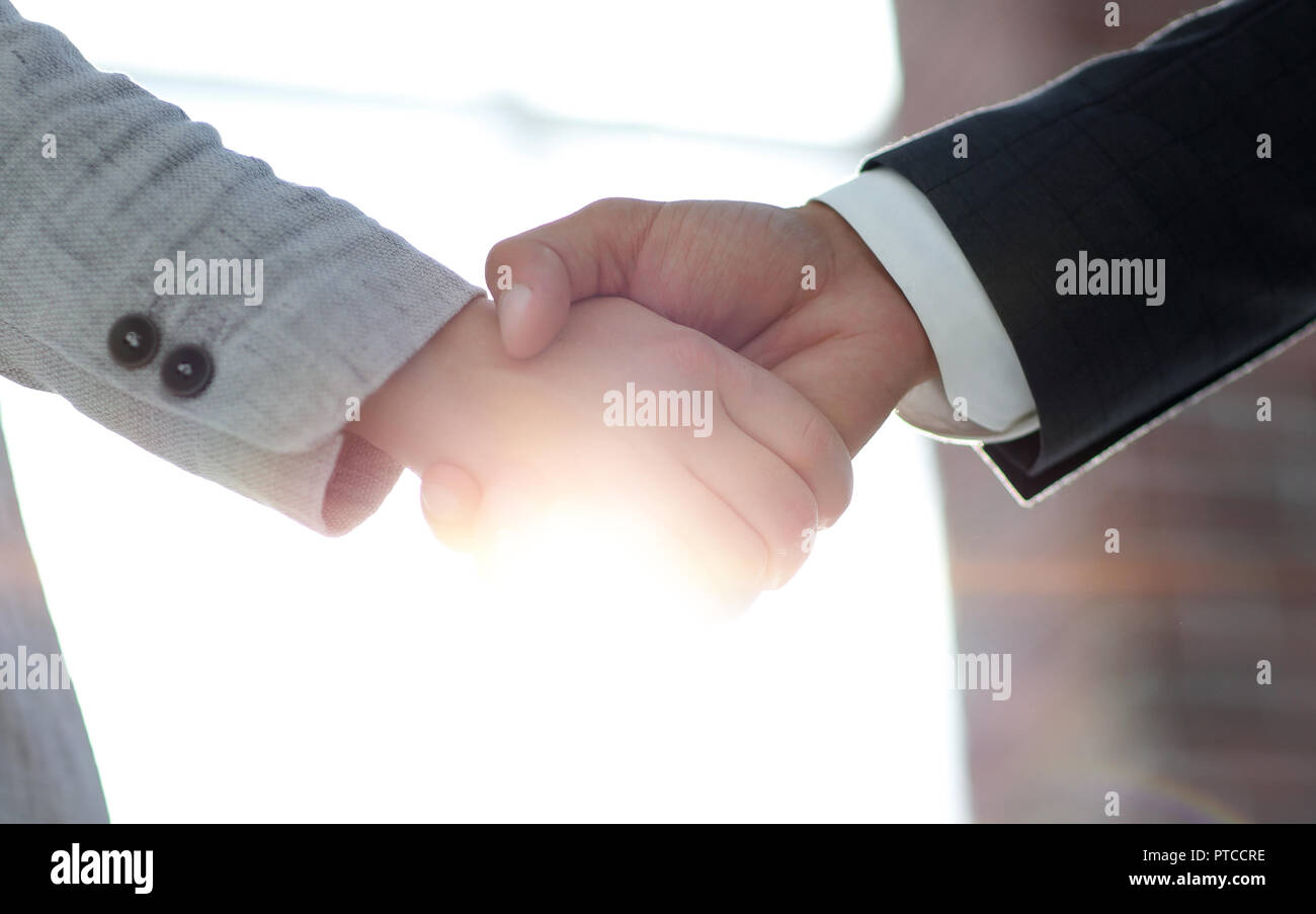 Business people shaking hands isolated on white background Stock Photo