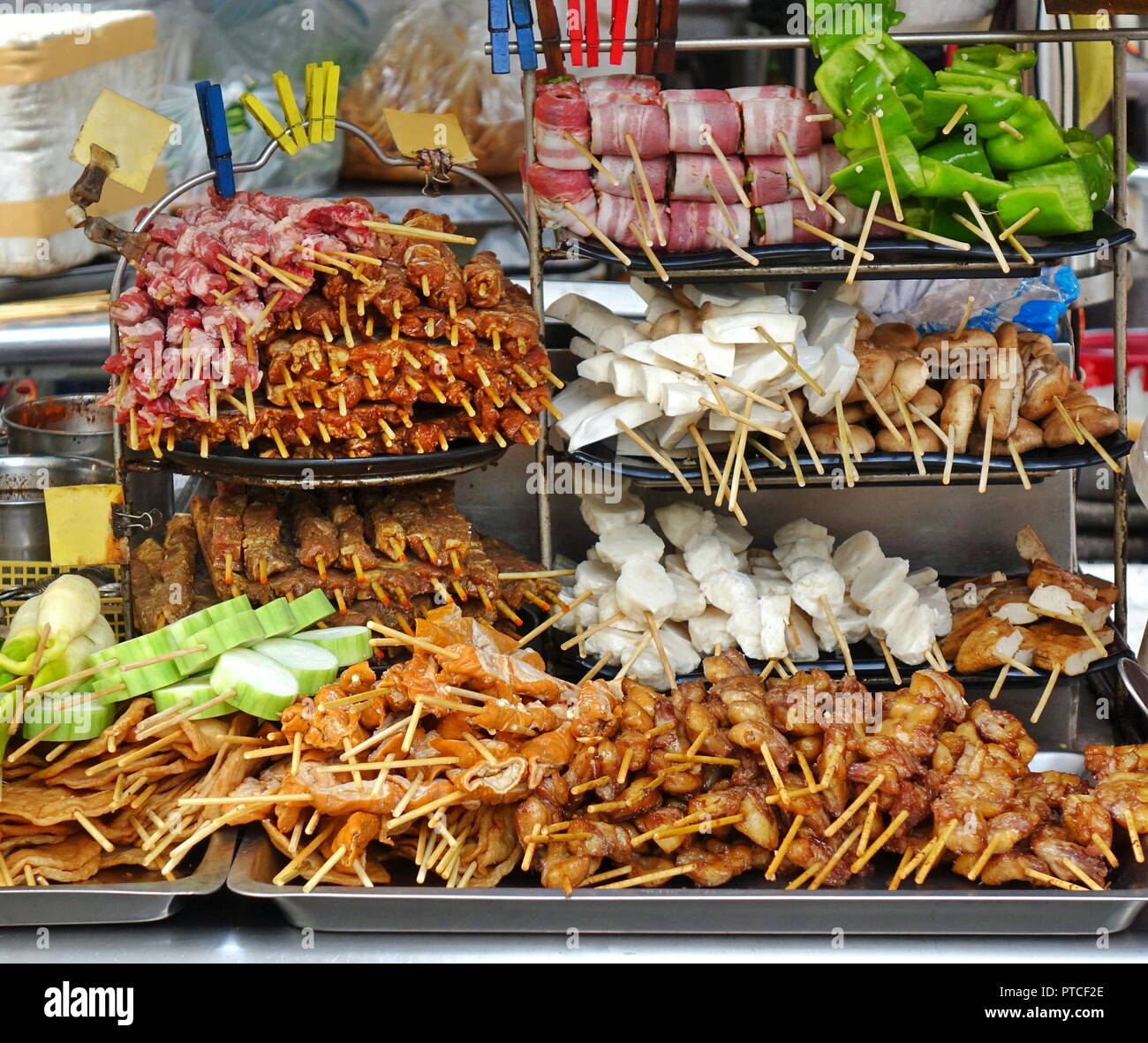 A street food stall in Taiwan offers a variety of meat and vegetable ...