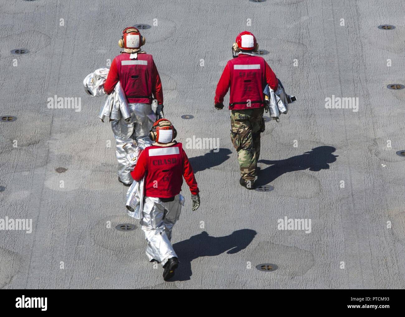 U.S. sailors with the crash and salvage team aboard USS Iwo Jima (LHD 7 ...