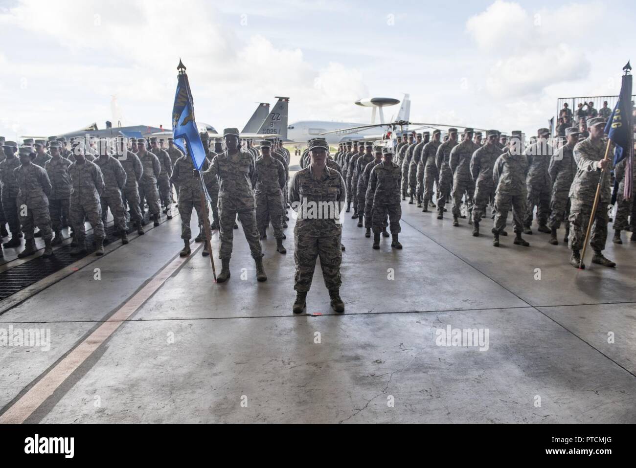U.S. Airmen from the 18th Wing stand in formation during the 18th Wing change of command ceremony July 10, 2017 at Kadena Air Base, Japan. The change of command is a traditional military ceremony in which the departing commander assembles troops for presentation to the incoming commander. Stock Photo