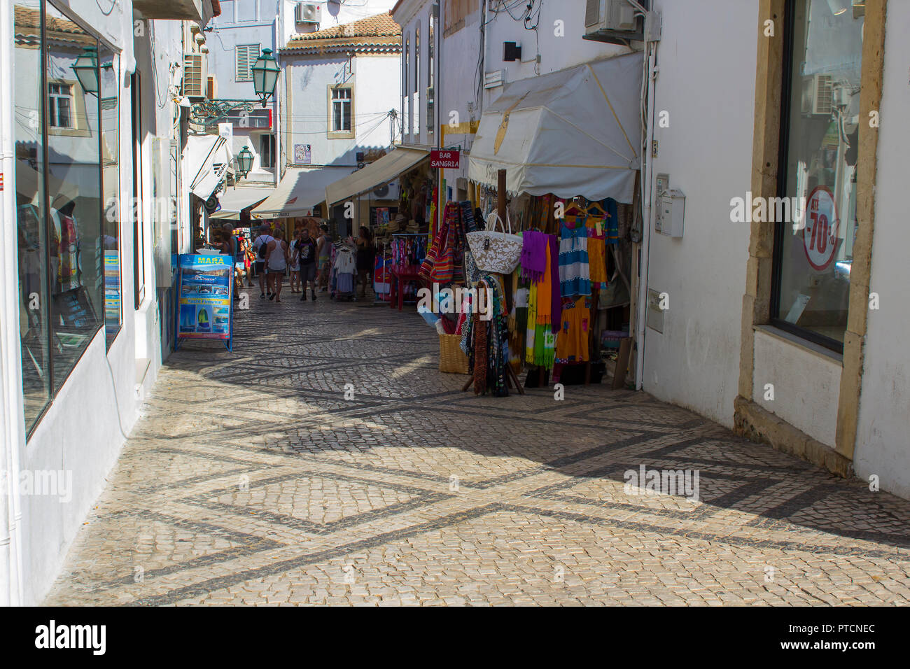 28 September 2018 Tourists stroll the cobbled streets of the Old Town in  Albuferia on the Algarve in Portugal on a hot sunny afternoon Stock Photo -  Alamy