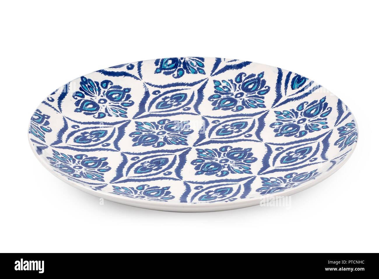 Blue dinner plate with oriental pattern isolated on white background. Stock Photo