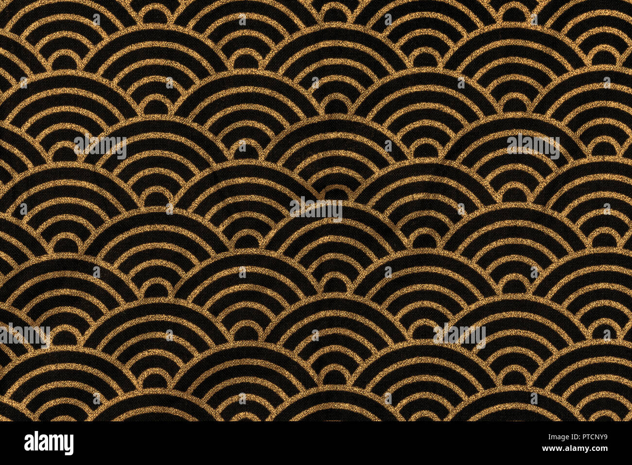 Highly detailed all over background texture of traditional japanese black and gold rainbow-shaped pattern design textile in synthetic fabric. Stock Photo