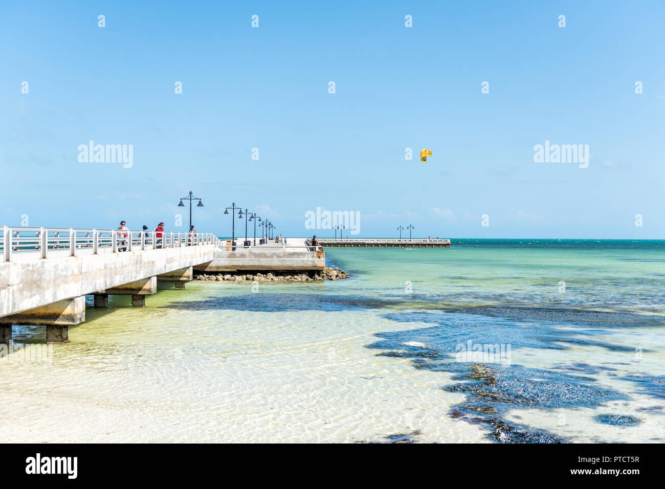 Key West, USA May 1, 2018 People walking on jetty, pier with one man