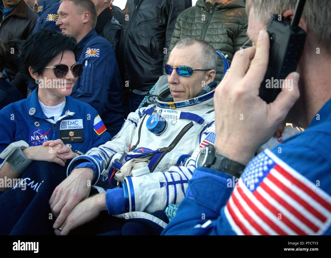 International Space Station Expedition 56 astronaut Drew Feustel rests outside the Russian Soyuz MS-08 spacecraft shortly after landing October 4, 2018 near Zhezkazgan, Kazakhstan. Stock Photo