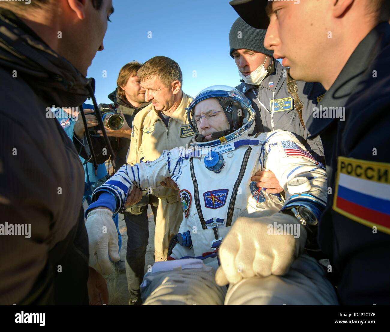 International Space Station Expedition 56 astronaut Drew Feustel is helped out from the Russian Soyuz MS-08 spacecraft shortly after landing October 4, 2018 near Zhezkazgan, Kazakhstan. Stock Photo