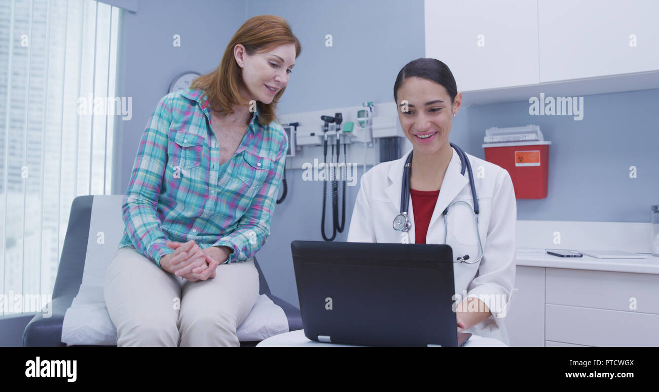 Doctor taking notes on checkup hi-res stock photography and images - Alamy