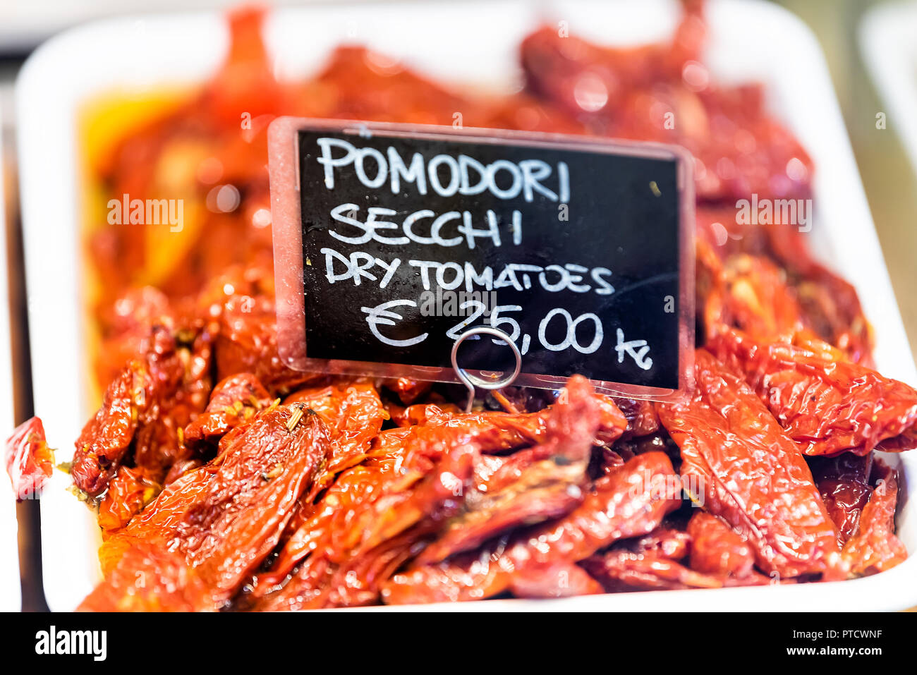 Sundried tomatoes pomodori secchi sign and dry red vegetable fruit in