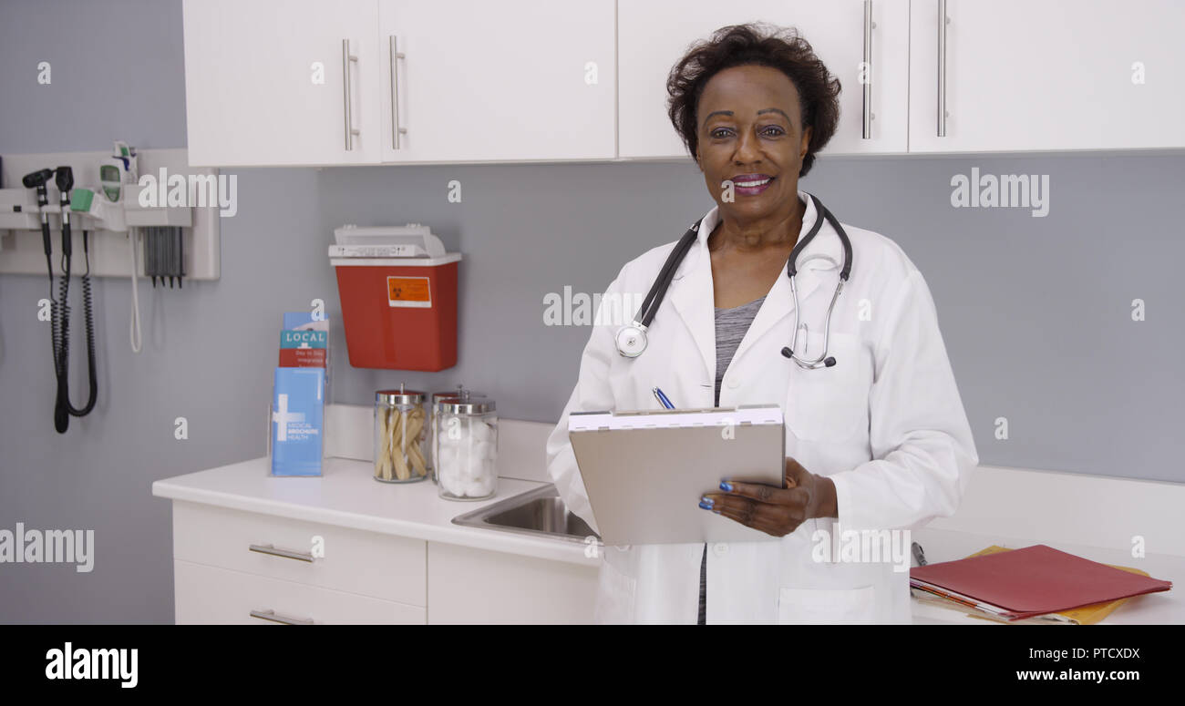 Positive female black doctor hi-res stock photography and images - Alamy