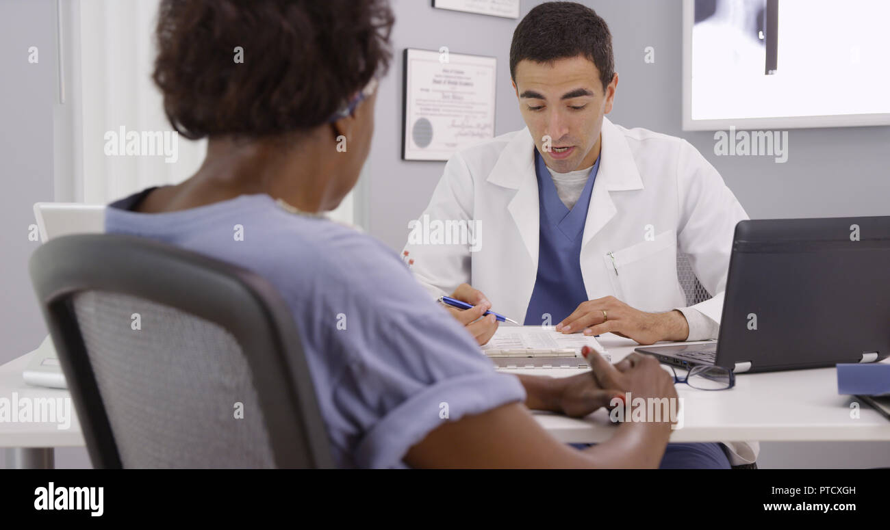 Senior black woman having appointment meeting with doctor about her mri Stock Photo