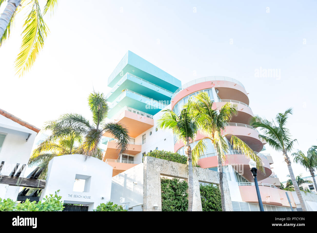 South Beach, USA - May 5, 2018: Entrance to colorful the Beach House hotel in Miami, Florida in Art Deco district with nobody during sunny day, palm t Stock Photo