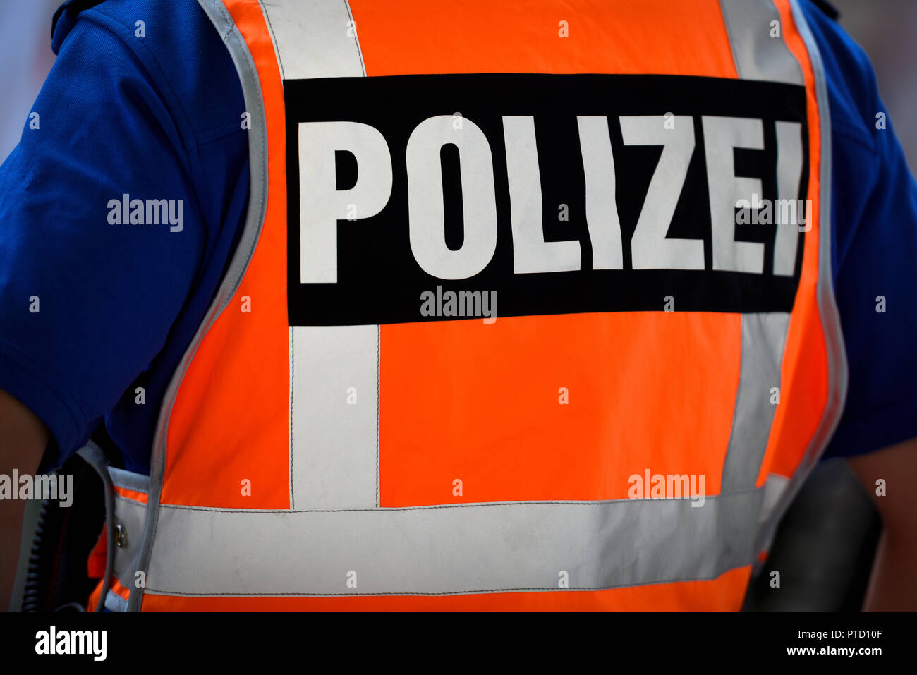 Inscription Police on protective vest, back view, Switzerland Stock Photo