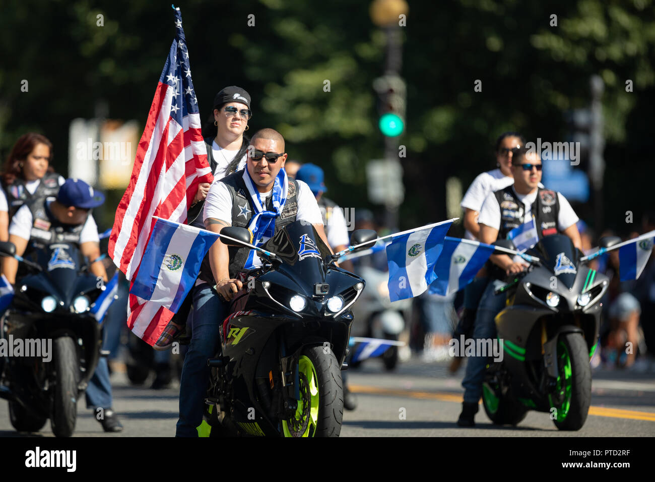 Washington, D.C., USA - September 29, 2018: The Fiesta DC Parade, Bikers from El Salvador carrying El Salvadoran Flags and the American Flag Stock Photo