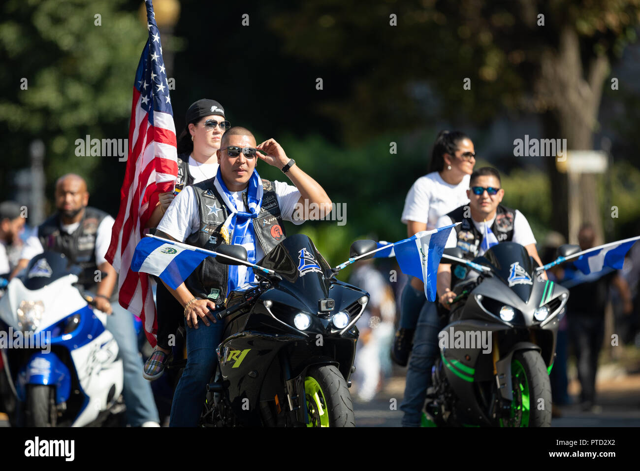 Washington, D.C., USA - September 29, 2018: The Fiesta DC Parade, Bikers from El Salvador carrying El Salvadoran Flags and the American Flag Stock Photo