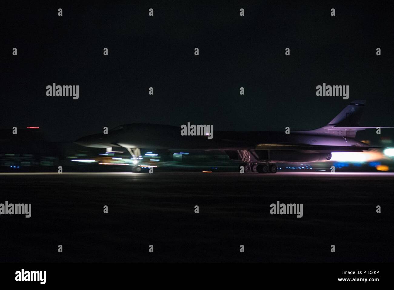 A U.S. Air Force B-1B Lancer assigned to the 9th Expeditionary Bomb Squadron, deployed from Dyess Air Force Base, Texas, takes off from Andersen Air Force Base, Guam to conduct a sequenced bilateral mission with South Korean F-15 and Koku Jieitai (Japan Air Self-Defense Force) F-2 fighter jets, July 7. The mission is in response to a series of increasingly escalatory action by North Korea, including a launch of an intercontinental ballistic missile (ICBM) on July 3. Stock Photo