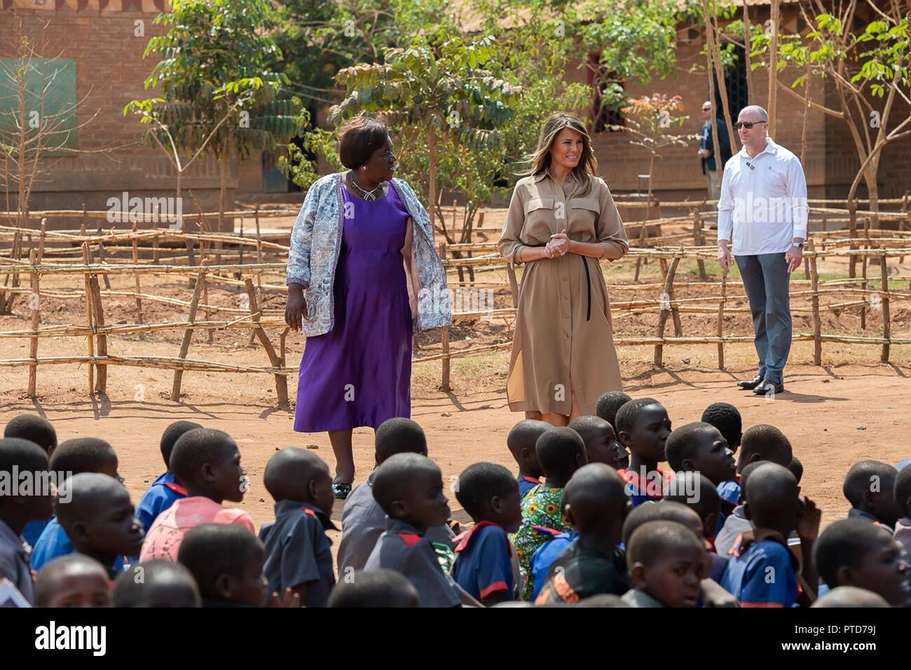 U.S First Lady Melania Trump and Headmistress Maureen Masi watch an outdoor classroom learning the English and Chichewa languages at the Chipala Primary School October 4, 2018 in Lilongwe, Malawi. This is the first solo international trip by the First Lady. Stock Photo