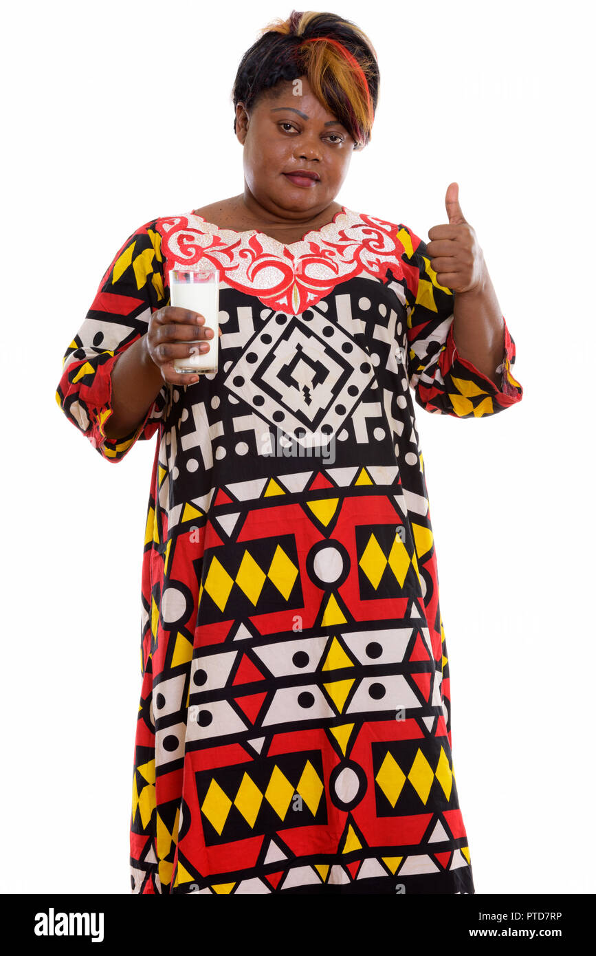 Studio shot of fat black African woman standing while holding gl Stock ...
