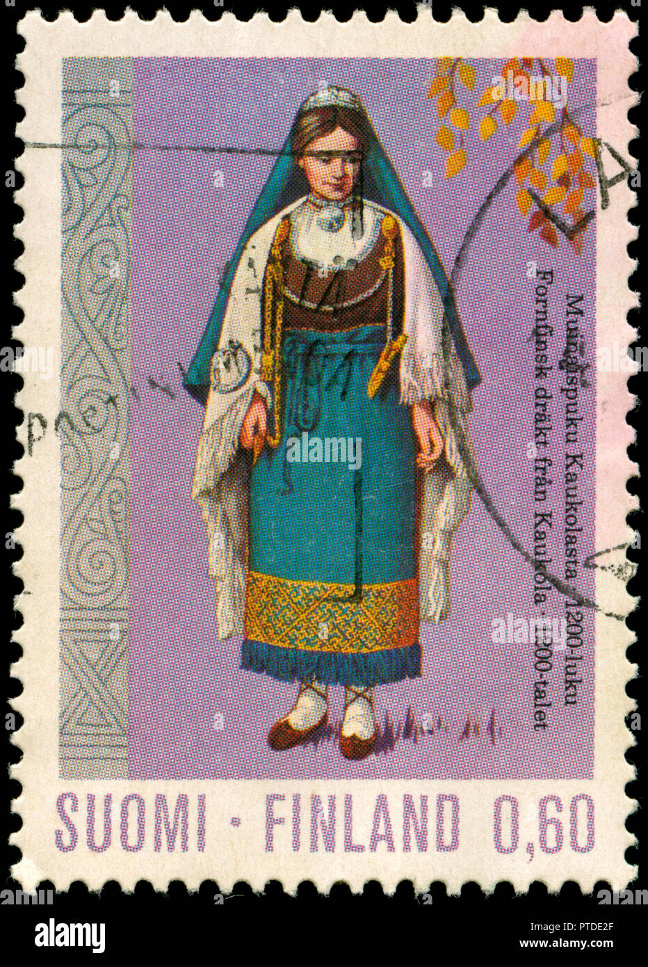 Postmarked stamp from Finland in the National costumes series issued in 1973 Stock Photo