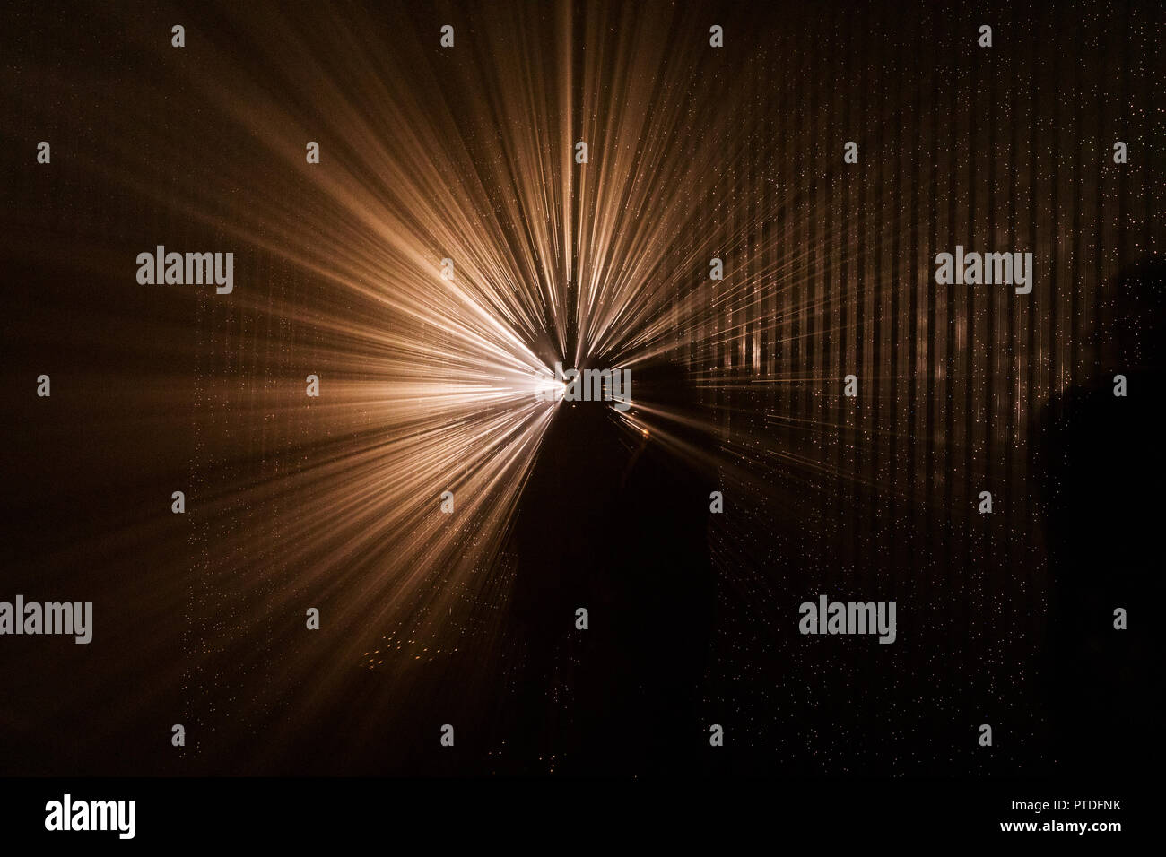 Light abstract projection. Colorful light rays. The silhouette of ...