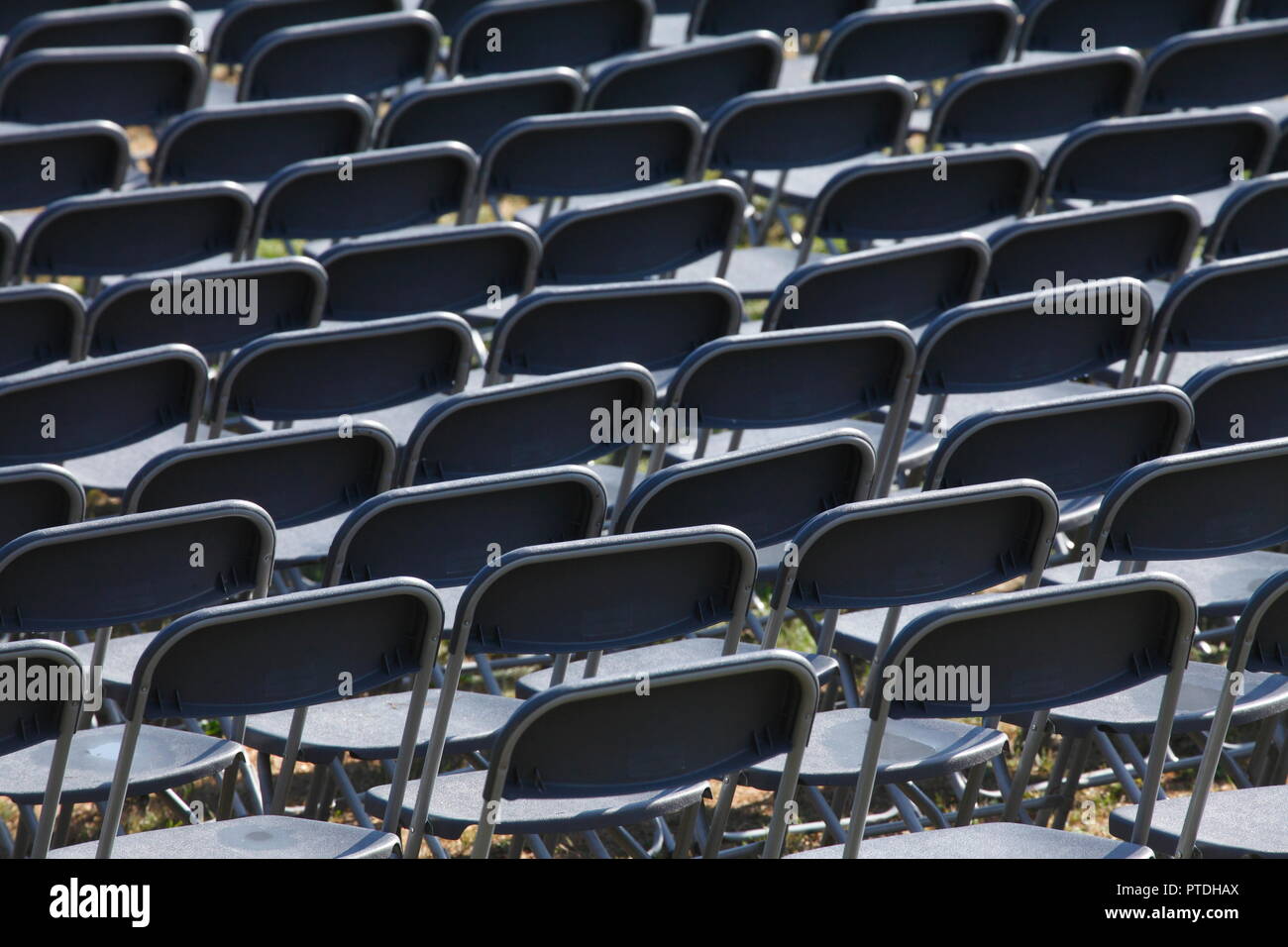 Gray plastic chairs, chair row Stock Photo Alamy