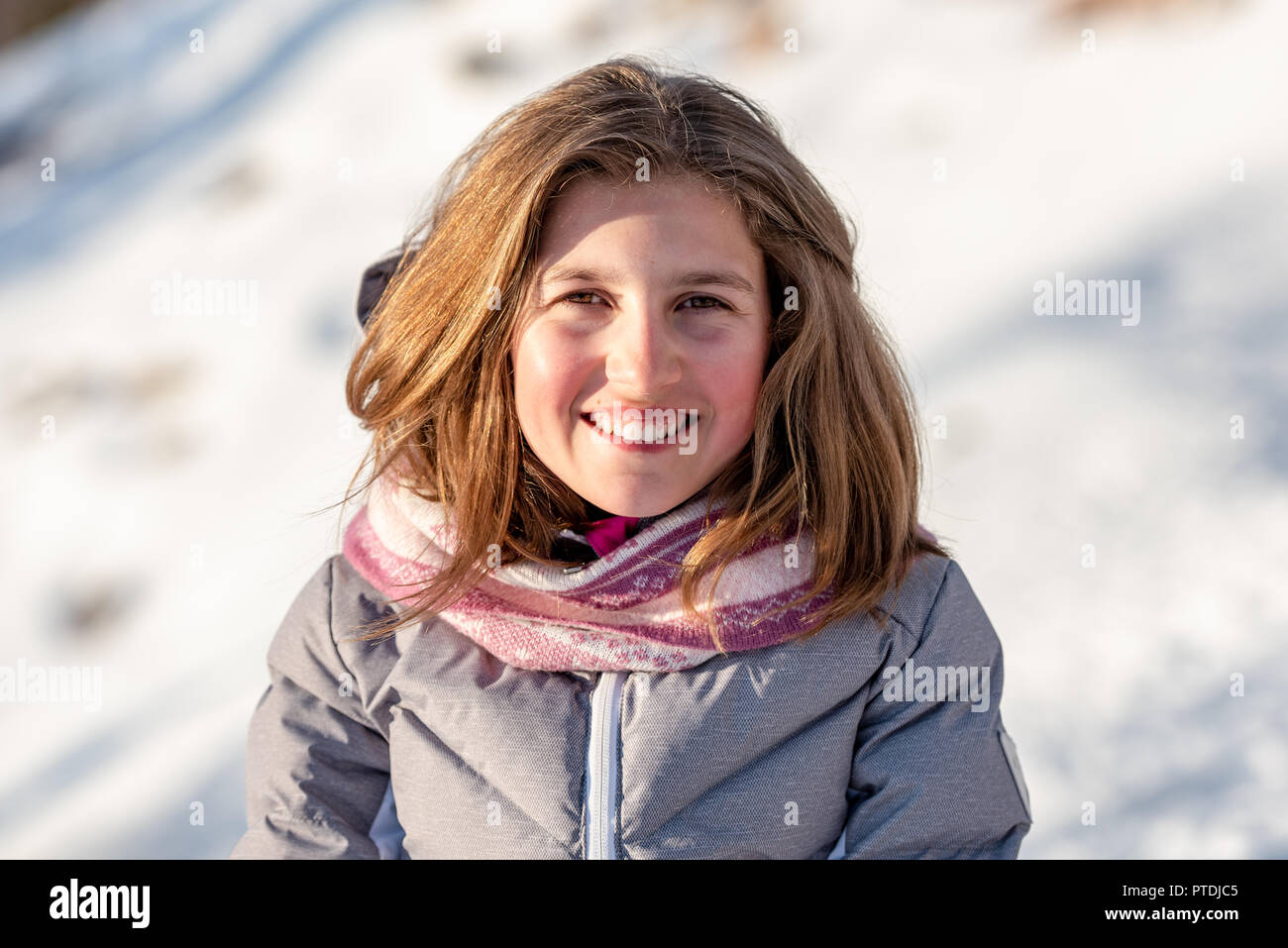 Cute Baby Girl With Winter Clothes On The Snow Stock Photo