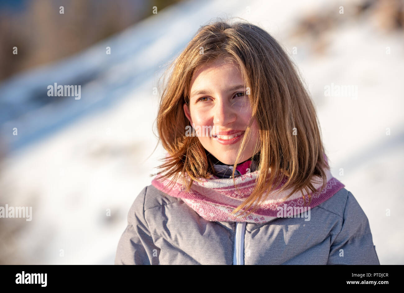 Cute Baby Girl With Winter Clothes On The Snow Stock Photo