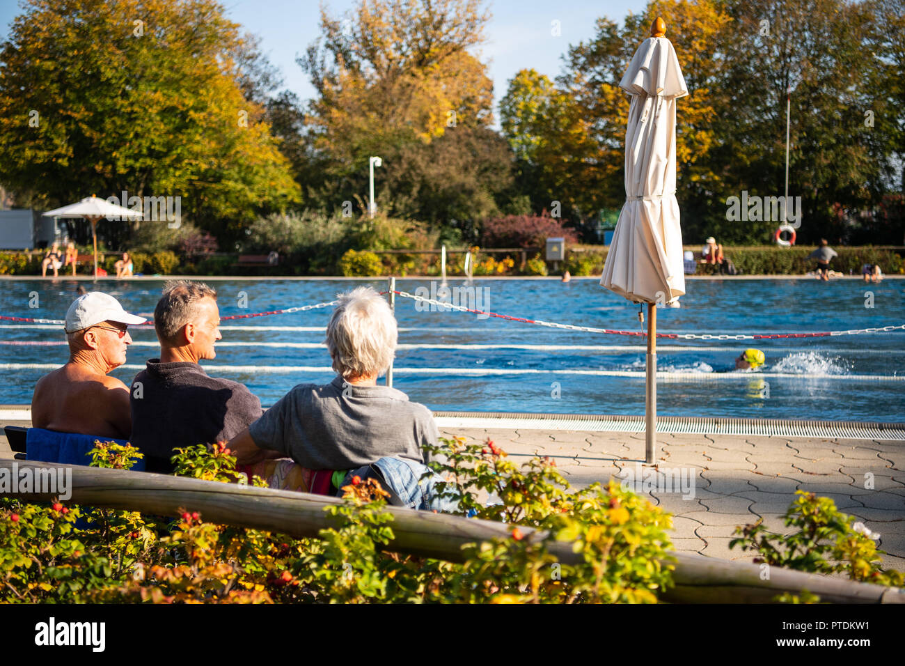 08 October 2018, BadenWuerttemberg, Tübingen Swimmers sit at the
